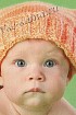 Оранжевая шапочка спицами для малыша