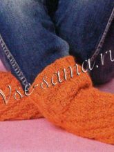 Оранжевые носочки-спиральки спицами