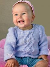 Сиреневая кофточка спицами с бантиками