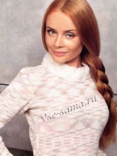 Меланжевый джемпер с косами