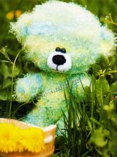 Меланжевый медвежонок спицами